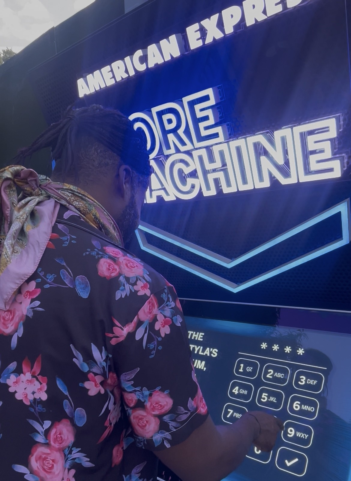 Festival For You team member playing an interactive game at the American Express brand activation, demonstrating the rise of experiential marketing at UK music festivals summer 2025.